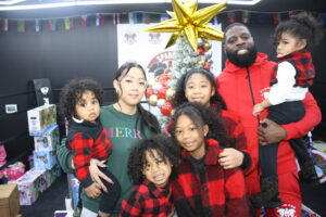 Rosie with her family at the 2023 holiday gift drive they organized