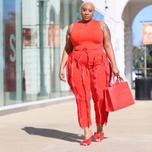 Kai Michelle shows off an orange jumpsuit