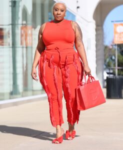 Kai Michelle shows off an orange jumpsuit