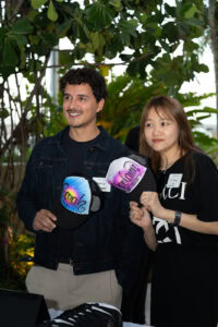 Influencers hold their custom airbrushed hats