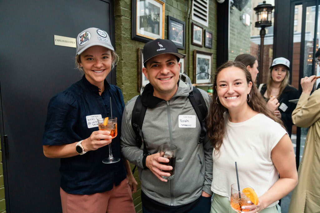 NYC Creator Meetup attendees sport custom trucker hats.