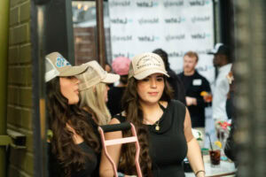 Attendees in custom trucker hats at the Cocktails & Collabs creator meetup event hosted by Later and Mavely
