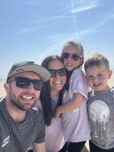 Mavely creator Megan Pizzi, owner of Living Rich With Coupons, poses with her family.