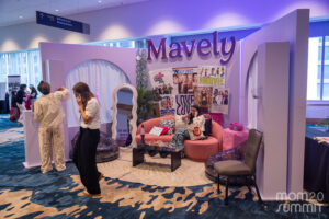 Mavely's booth at Mom 2.0 was themed to look like a Y2K-era teen girl's bedroom, bringing nostalgia and fun to mom creators at the event