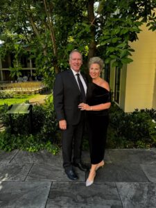 Midsize fashion and lifestyle creator Julie McCoy in the "traveling" dress that went viral for its ability to look good on everyone.